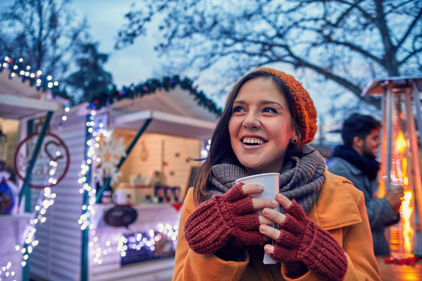 Woman,Having,Hot,Drink,Outdoors,On,Winter,Market
